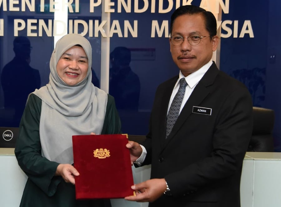 The Education Ministry has announced the appointment of Azman Adnan (right) as the new Education director-general. -PIC COURTESY OF MOE