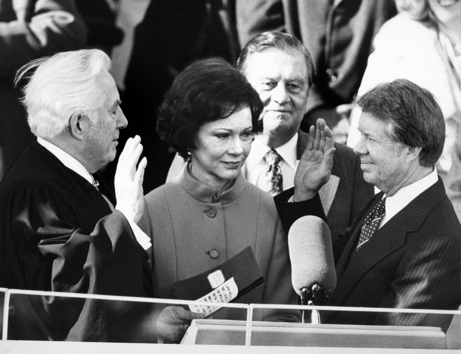 (FILE PHOTO) Chief Justice Warren Burger administers the oath of office to Jimmy Carter (right) as the 39th President of the United Sates on January 20, 1977 as Rosalynn Carter (centre) looks on. Former US first lady Rosalynn Carter died at age 96 at her home in Georgia, the couple's non-profit organisation announced on November 19, 2023. -AFP/CONSOLIDATED NEWS