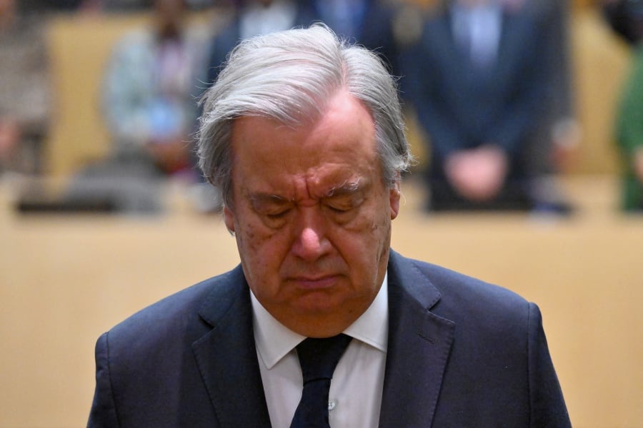 UN Secretary-General Antonio Guterres observes a minute of silence in memory of colleagues killed in Gaza. call for an immediate humanitarian ceasefire in Gaza after two UN Relief and Works Agency for Palestinian Refugees (UNRWA) schools were bombed in less than 24 hours on Saturday. -AFP/ANGELA WEISS