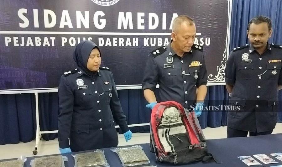 Kubang Pasu district police chief Superintendent Rodzi Abu Hassan said police have arrested two men suspected of trafficking over 10 kilogrammes of marijuana at a car park lot near RTC Napoh. -NSTP/ZULIATY ZULKIFILI