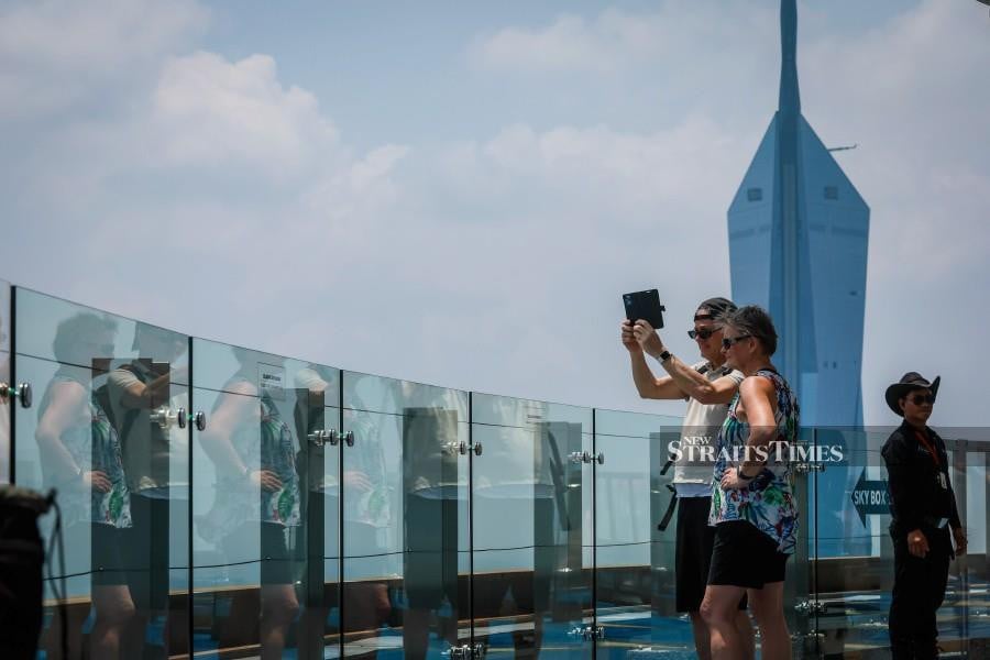Tourists in Kuala Lumpur. -NSTP/ASYRAF HAMZAH