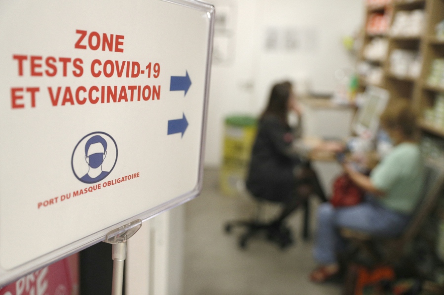 A woman speaks to a pharmacy employee before receiving a dose of vaccine during a new Covid-19 vaccination campagin on the French Mediterranean island of Corsica. The US Centers for Disease Control and Prevention (CDC) said on Friday that Covid sub-variant JN.1 accounts for 39 per cent to 50 per cent of cases in the United States as of Dec 23, according to the agency's projections. -AFP/Pascal POCHARD-CASABIANCA