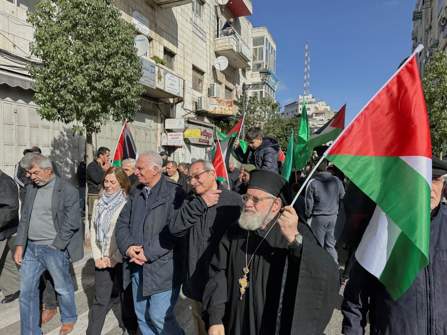 People march as they take part in a protest in support of Palestinians in Gaza in Ramallah, in the Israeli-occupied West Bank, December 22, 2023. -REUTERS/Ali Sawafta