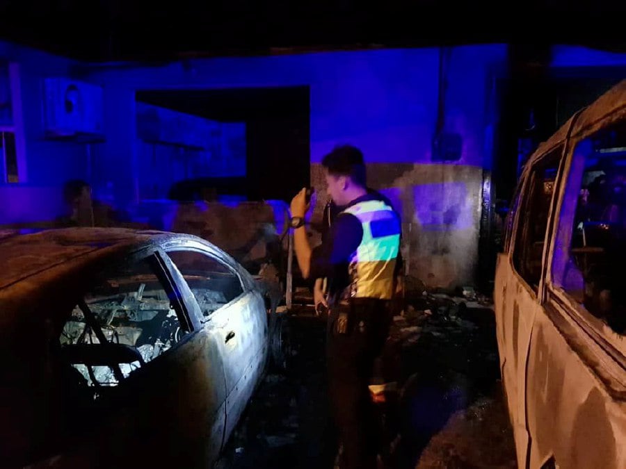 Heroic man died from smoke inhalation after rescuing his neighbours from a fire at a house in Merinding Garden in Labuan. -PIC COURTESY OF PDRM