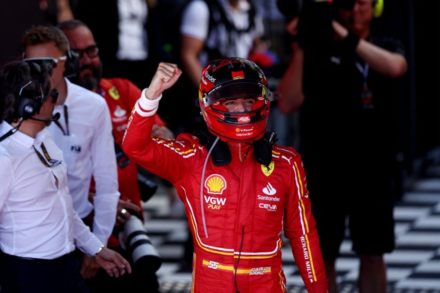 Ferrari's Spanish driver Carlos Sainz Jr celebrates victory after the Australian Formula One Grand Prix at Albert Park Circuit in Melbourne. -AFP/Martin KEEP