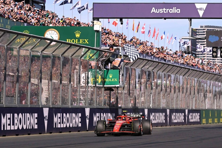 Ferrari's Spanish driver Carlos Sainz Jr wins the Australian Formula One Grand Prix at Albert Park Circuit in Melbourne on March 24, 2024. -AFP/WILLIAM WEST