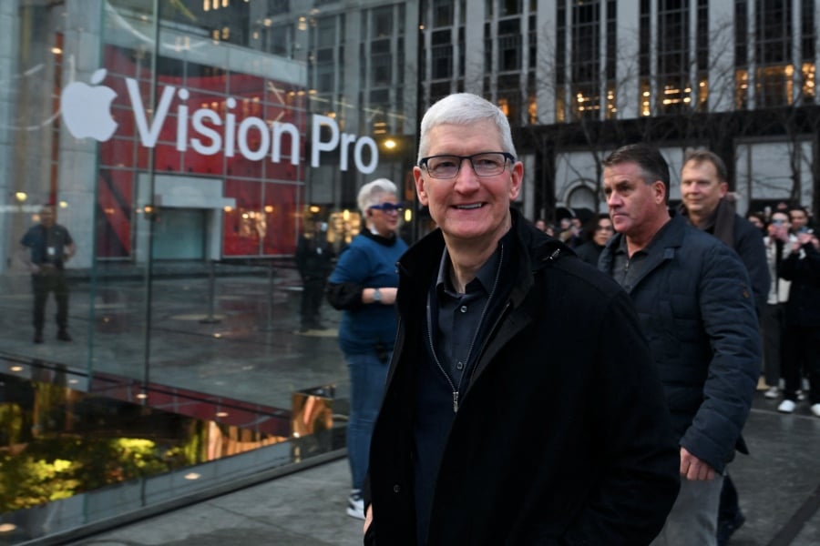 (FILE PHOTO) Apple CEO Tim Cook arrives for the release of the Vision Pro headset at the Apple Store in New York City. Apple Vision Pro will hit the mainland China market this year, Apple chief executive Tim Cook said on Sunday, according to state media. -AFP/ANGELA WEISS