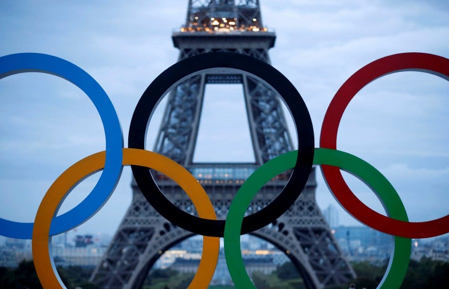 (FILE PHOTO) Olympic rings to celebrate the IOC official announcement that Paris won the 2024 Olympic bid are seen in front of the Eiffel Tower at the Trocadero square in Paris, France. -REUTERS/Christian Hartmann