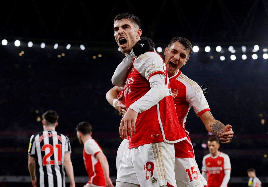 Arsenal's Kai Havertz celebrates scoring their second goal with Jakub Kiwior Action. -REUTERS/Andrew Couldridge