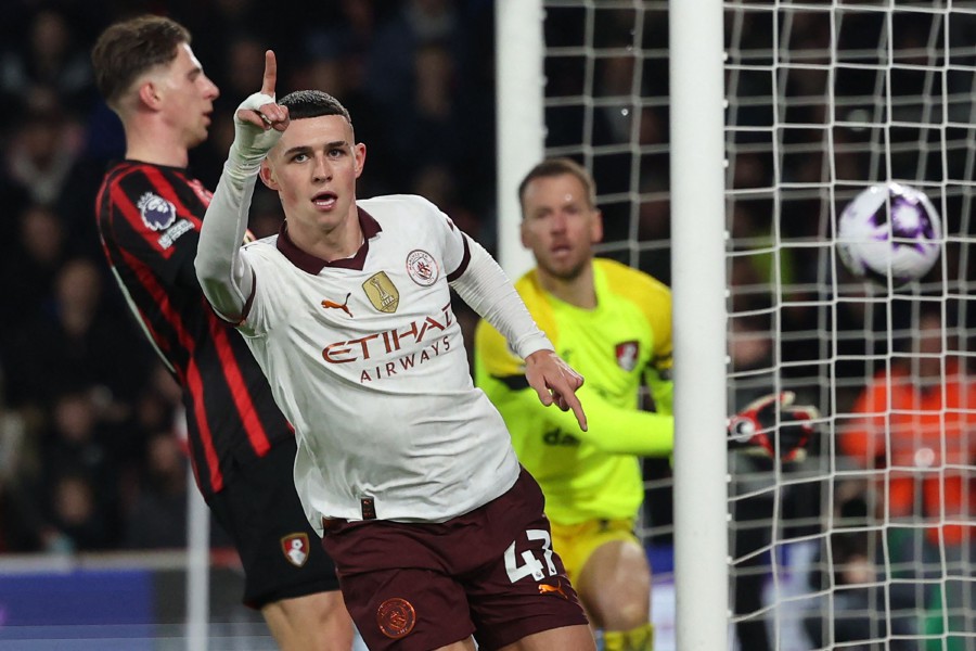 Manchester City's English midfielder #47 Phil Foden celebrates after scoring the opening goal of the English Premier League football match between Bournemouth and Manchester City at the Vitality Stadium in Bournemouth, southern England on February 24, 2024. -AFP/Adrian DENNIS