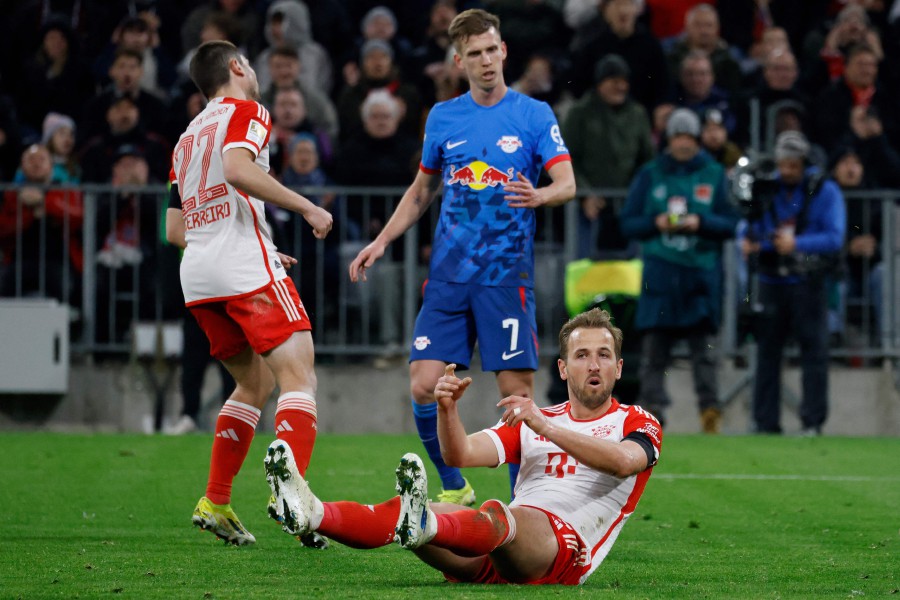 Bayern Munich's English forward #09 Harry Kane ends up on the ground during the German first division Bundesliga football match between FC Bayern Munich and RB Leipzig in Munich, southern Germany on February 24, 2024. -AFP/MICHAELA STACHE