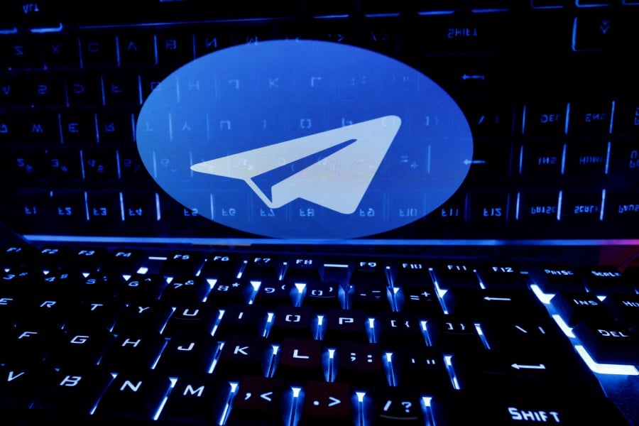 (FILE PHOTO) A keyboard is placed in front of a displayed Telegram logo. -REUTERS/Dado Ruvic
