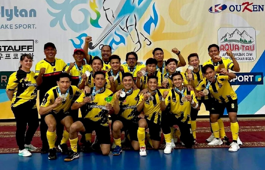 The national players with their silver medals at the Indoor Hockey Asia Cup in Kazakhstan today. -PIC COURTESY OF MHC