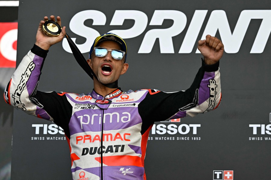 Ducati Spanish rider Jorge Martin celebrates on the podium after winning the sprint race of the MotoGP Valencia Grand Prix at the Ricardo Tormo racetrack in Cheste. -AFP/JAVIER SORIANO