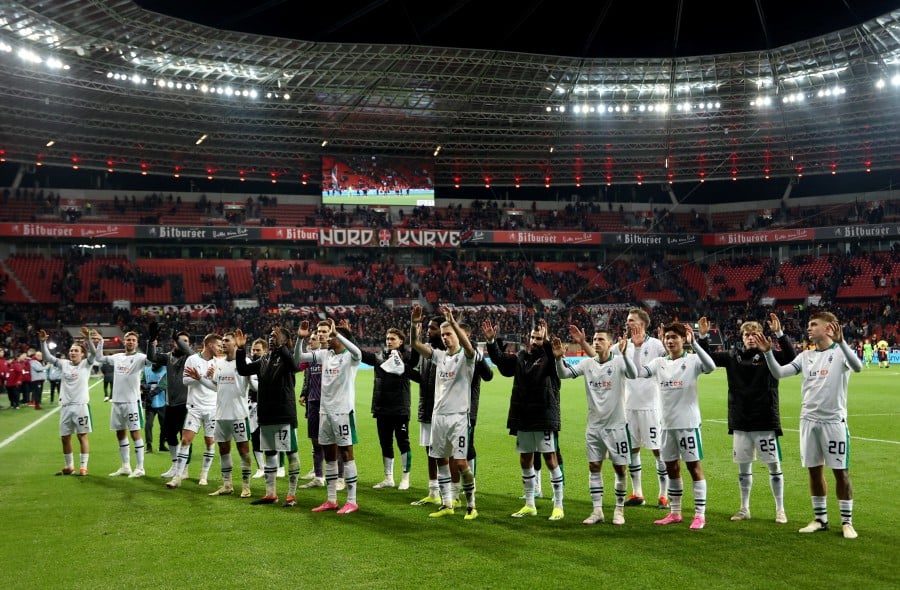 Borussia Moenchengladbach players react after the match. -REUTERS/Thilo Schmuelgen