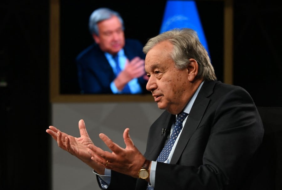 UN Secretary-General Antonio Guterres speaks during an interview at the United Nations headquarters ahead of the COP28 meeting in New York, November 29, 2023. The COP28 climate conference should aim for a complete "phaseout" of fossil fuels, UN Secretary-General Antonio Guterres told AFP on November 29, warning of "total disaster" on humanity's current trajectory."Obviously I am strongly in favour of language that includes (a) phaseout, even with a reasonable time framework," Guterres said in an interview before flying off to the United Arab Emirates, the oil-rich nation hosting the two-week UN climate summit beginning November 30. -AFP/Andrea RENAULT