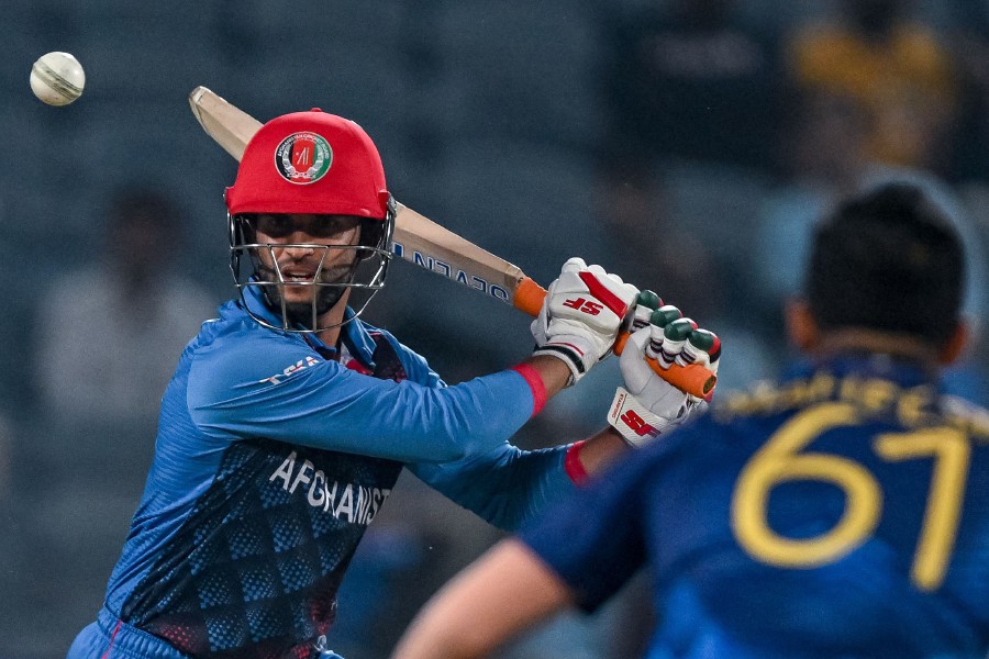 Afghanistan's Azmatullah Omarzai plays a shot during the 2023 ICC Men's Cricket World Cup one-day international (ODI) match between Afghanistan and Sri Lanka at the Maharashtra Cricket Association Stadium in Pune. -AFP/INDRANIL MUKHERJEE