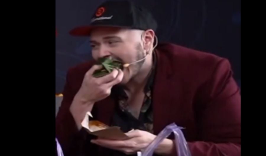 Screengrab of a video showing an e-sport player eating a pack of nasi lemak. -PIC CREDIT: X/OGESPORTS