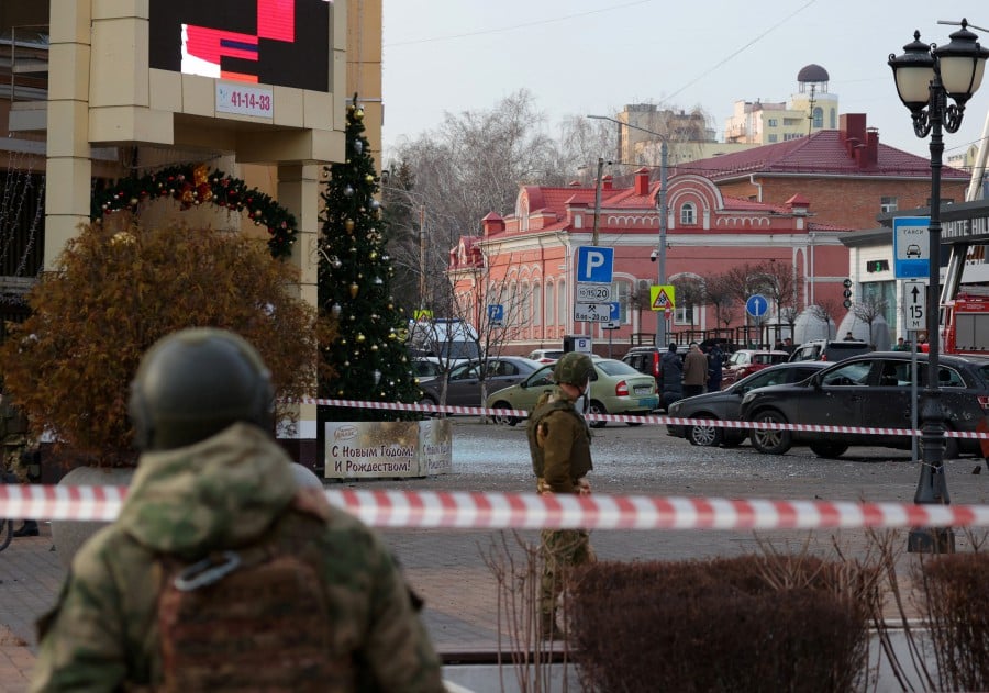 Russian service members secure the area following what Russian authorities say was a Ukrainian military strike in Belgorod, Russia December 30, 2023. -REUTERS PIC