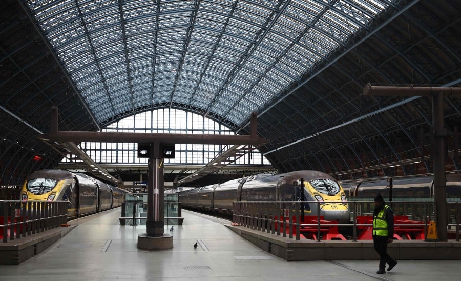 Eurostar trains are seen parked up on empty platforms at St Pancras station in London. Eurostar trains will run as normal Sunday, hours after an entire day's services had to be cancelled, causing misery for tens of thousands of New Year travellers. -AFP/HENRY NICHOLLS