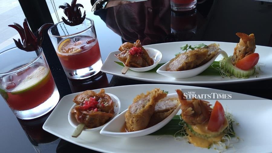 AC Lounge serves Malaysian-flavoured tapas and signature drink, Signature Roselle during AC Hour.
