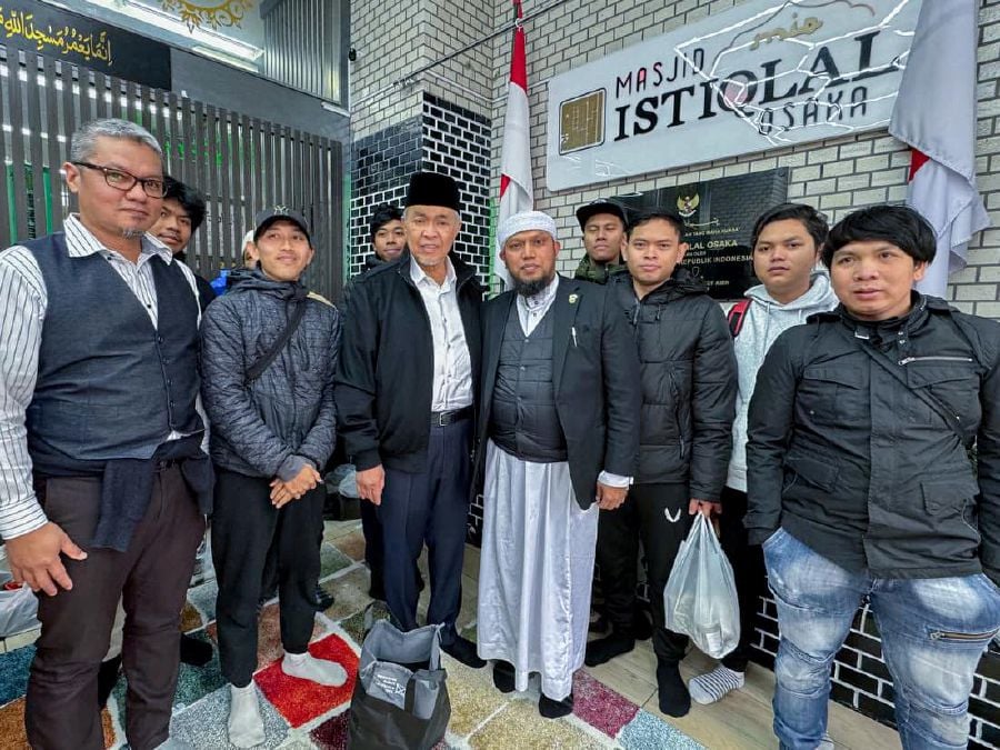 Deputy Prime Minister Datuk Seri Dr Ahmad Zahid Hamidi with some of the congregation at the Istiqlal Mosque in Osaka. -- Pic from Facebook