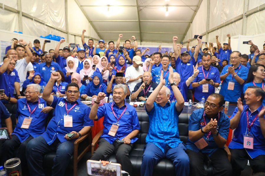 Barisan Nasional Chairman Datuk Seri Dr Ahmad Zahid Hamidi with Datuk Seri Najib Razak cheer on from the party’s operation room. - Pic source: ZahidHamidi/Telegram