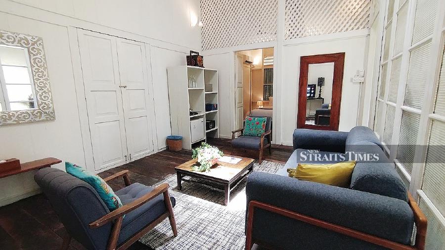 The cosy and homely living space of Penang Suite 2. The doors connect to Penang Suite 1, which allows Penang House to be rented as a whole.