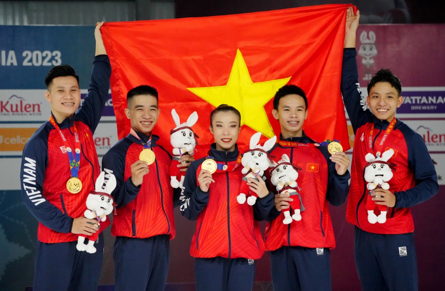 Vietnam's team celebrates winning gold medal in the aerobic gymnastic group final. -- REUTERS